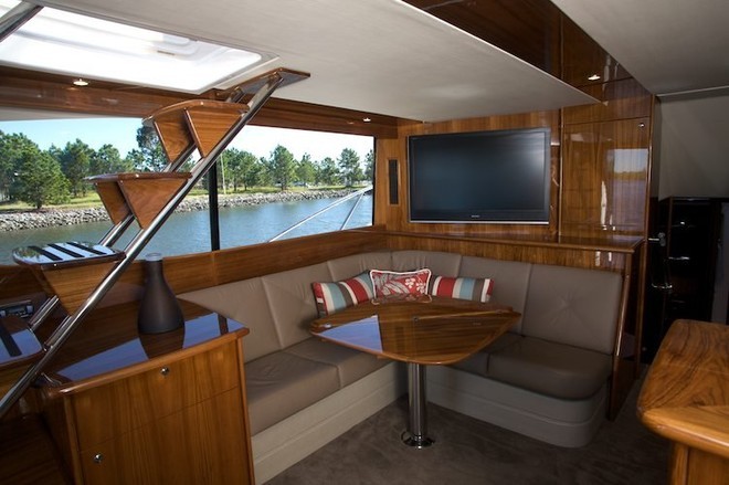 Saloon is spacious and in its own way luxurious; note the Maritimo ’trademark’, the polished timber staircase to the left offering easy access above and below to the ’bridge. - Maritimo 500 Offshore Convertible © SW